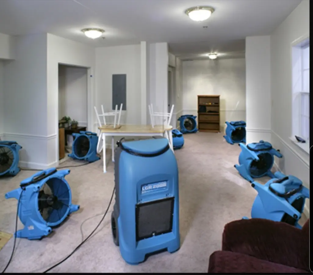 Air movers and dehumidifier setup for Water Extraction & Removal in White